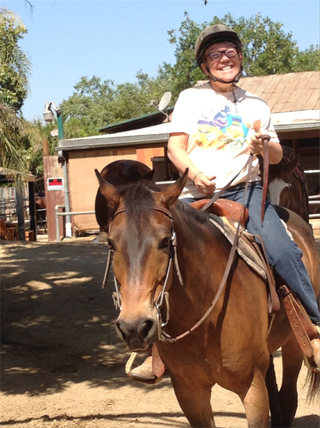 an image of a woman on horseback